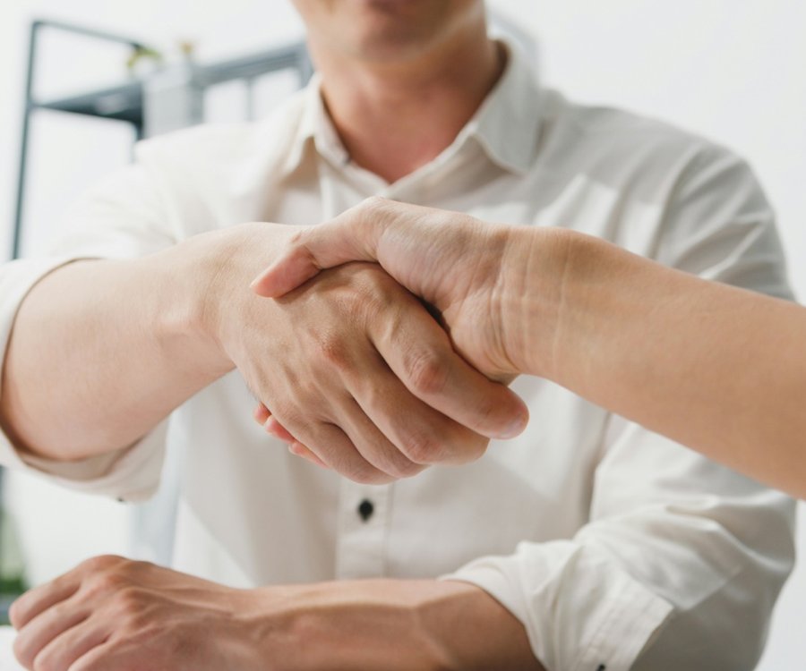 Confident dry-handed handshake after hand sweating treatment at Florida Aesthetics and Wellness Brandon FL
