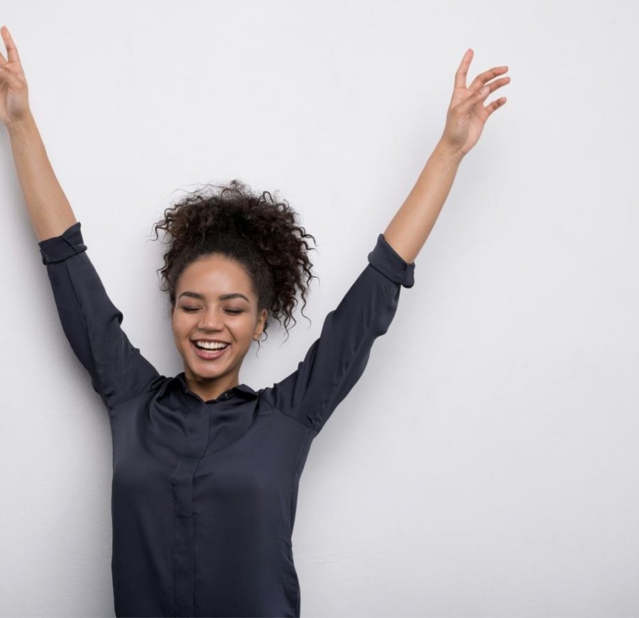 Confident woman with dry underarms after hyperhidrosis treatment at Florida Aesthetics and Wellness Brandon FL