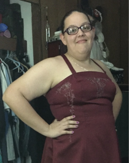 Sabrina before her medical weight loss, front view in a red dress