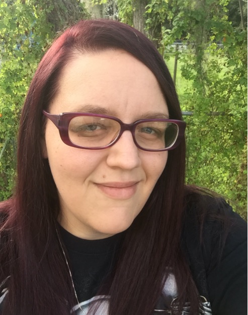 Sabrina smiling outdoors after her weight loss journey