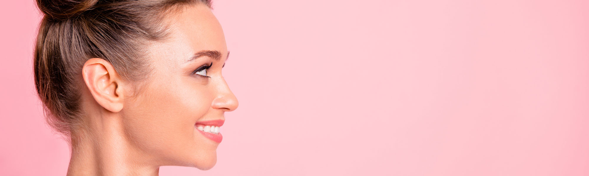 Close-up profile side view of nice lovely cute fascinating attractive groomed cheerful cheery girl looking aside copy empty blank space place isolated over pink pastel background